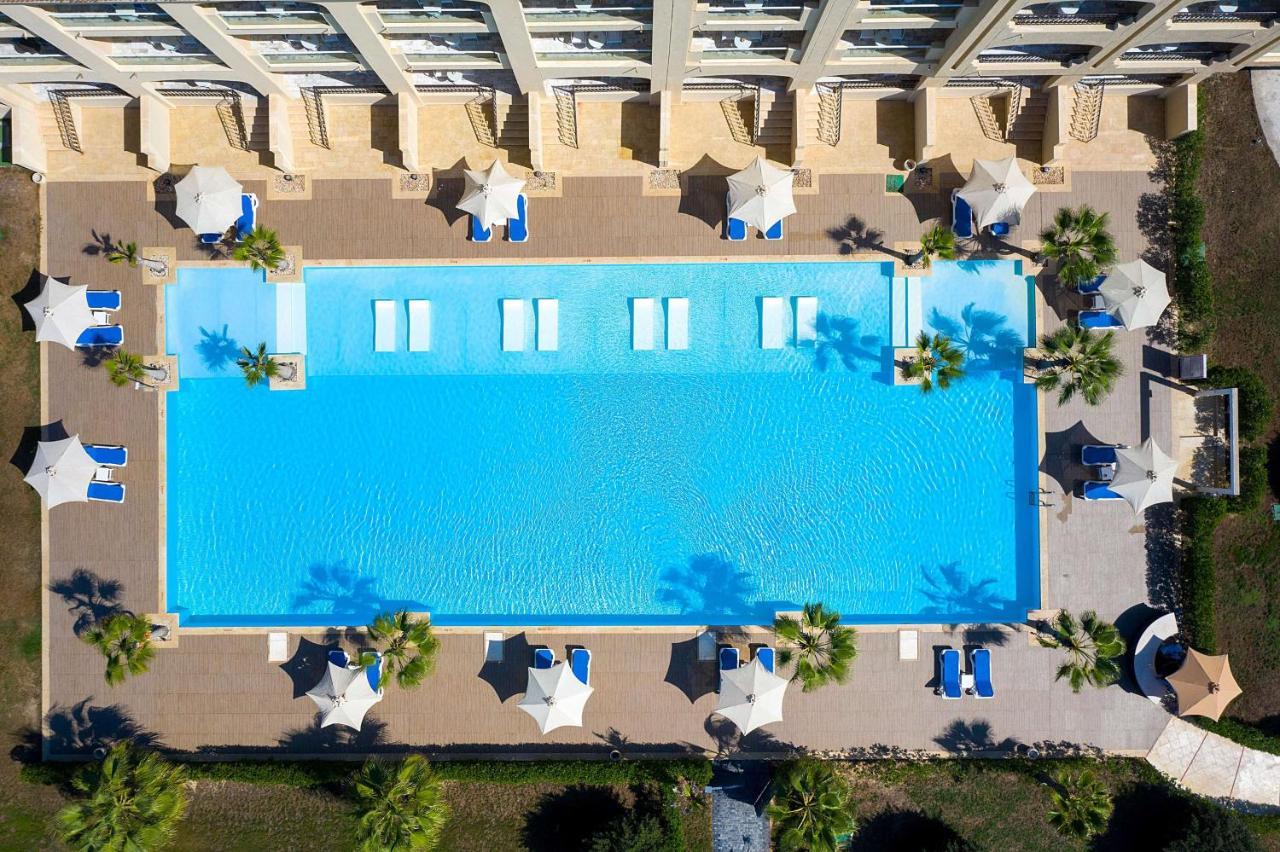 Rixos Alamein - Full Board Plus El Alamein Bagian luar foto Aerial view of the pool at the Hilton Mauritius Resort