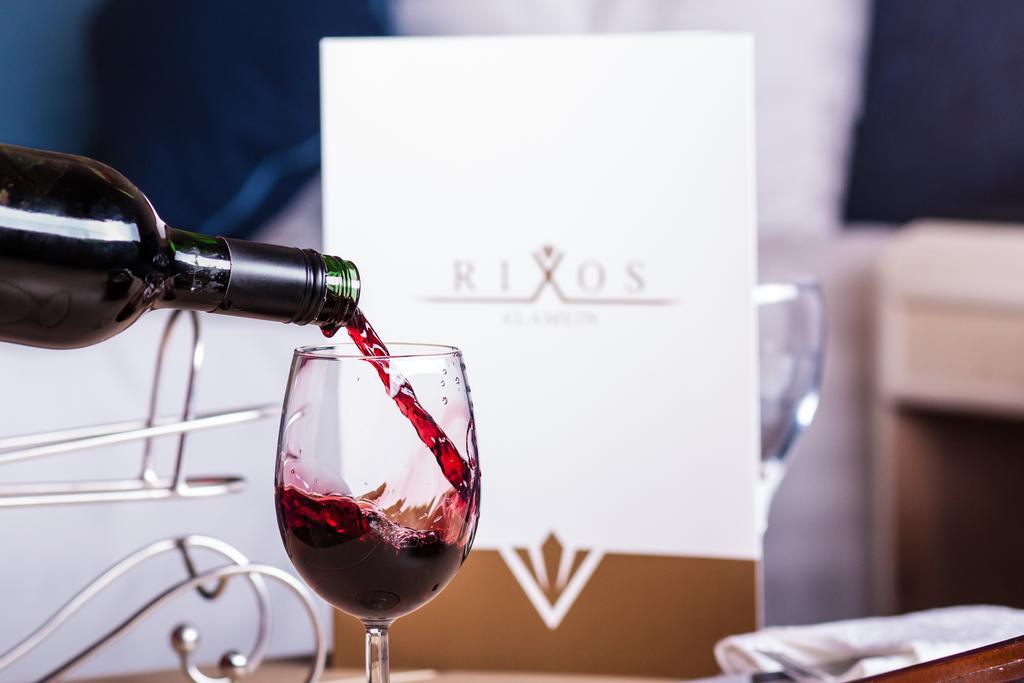 Rixos Alamein - Full Board Plus El Alamein Bagian luar foto Wine being poured into a wine glass