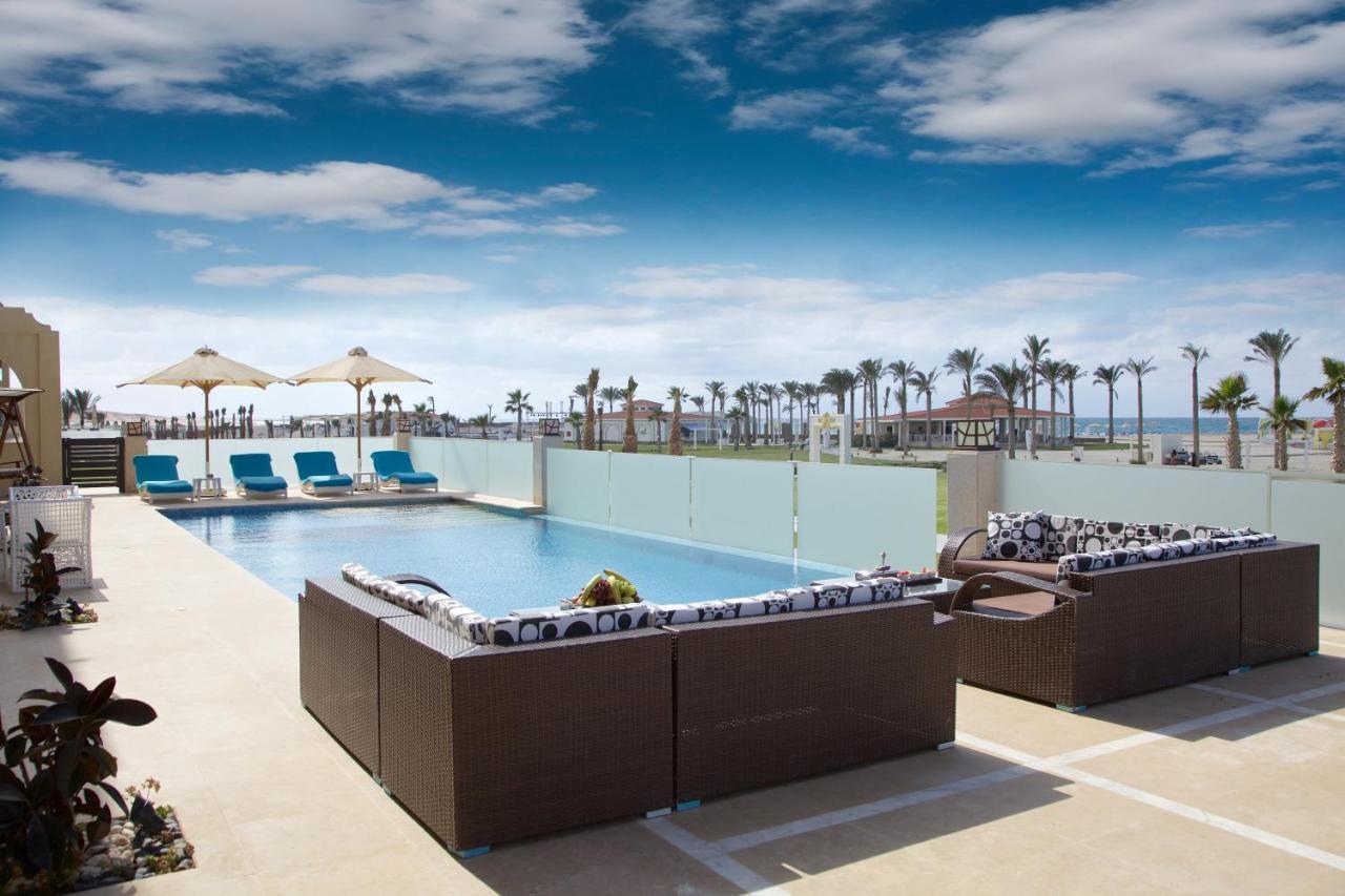 Rixos Alamein - Full Board Plus El Alamein Bagian luar foto The pool at the Hilton Sharm El Sheikh