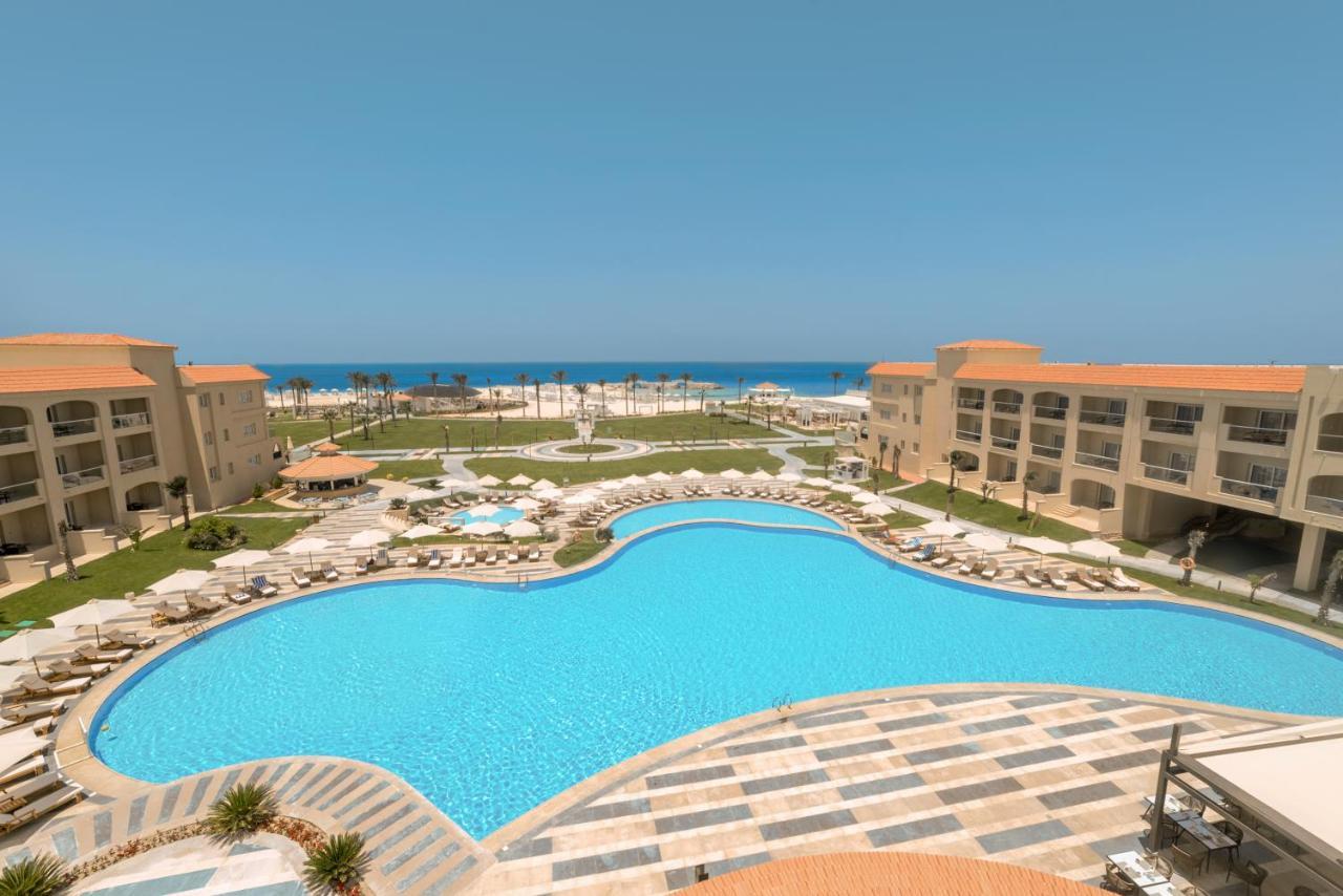 Rixos Alamein - Full Board Plus El Alamein Bagian luar foto A pool at a resort in Egypt